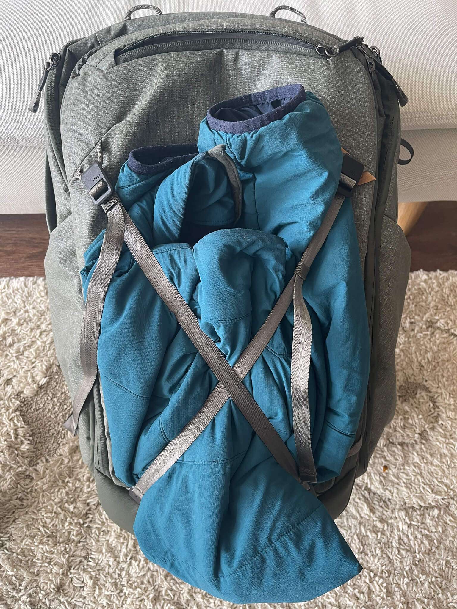 You can use the gear lash to secure jackets to the outside
